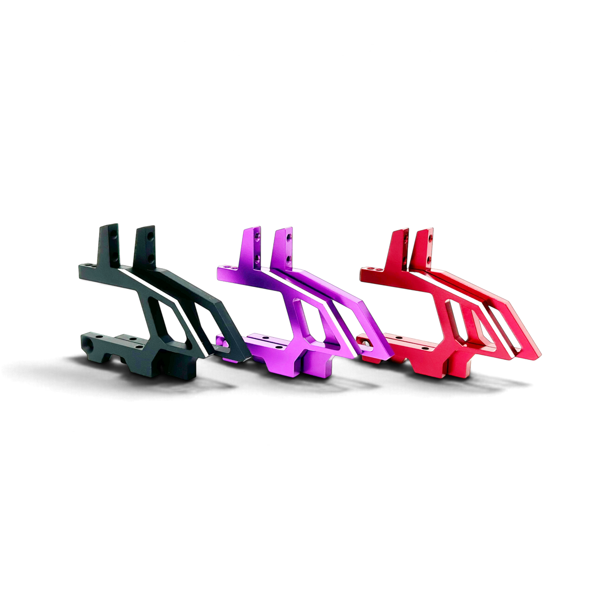 Trois nez de châssis en aluminium DriftParadiZ pour modèles RC, disponibles en noir, violet et rouge.