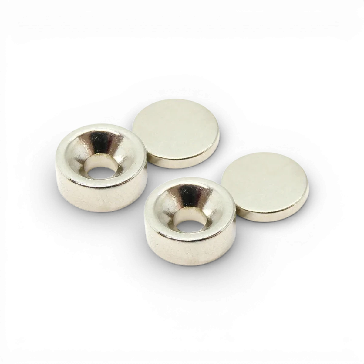 Deux aimants Wrap-UP Next de 12x5mm et 12x2mm, cylindriques, visibles avec surface métallique brillante.