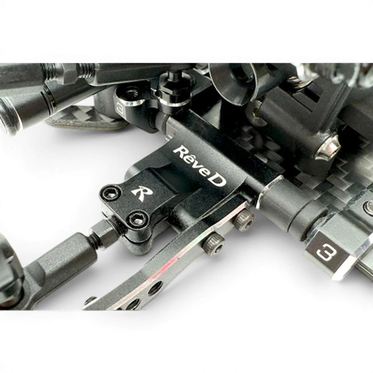Bras inférieur arrière pour voiture RC Drift Team Reve D, pièce de rechange en plastique noir avec détails techniques.
