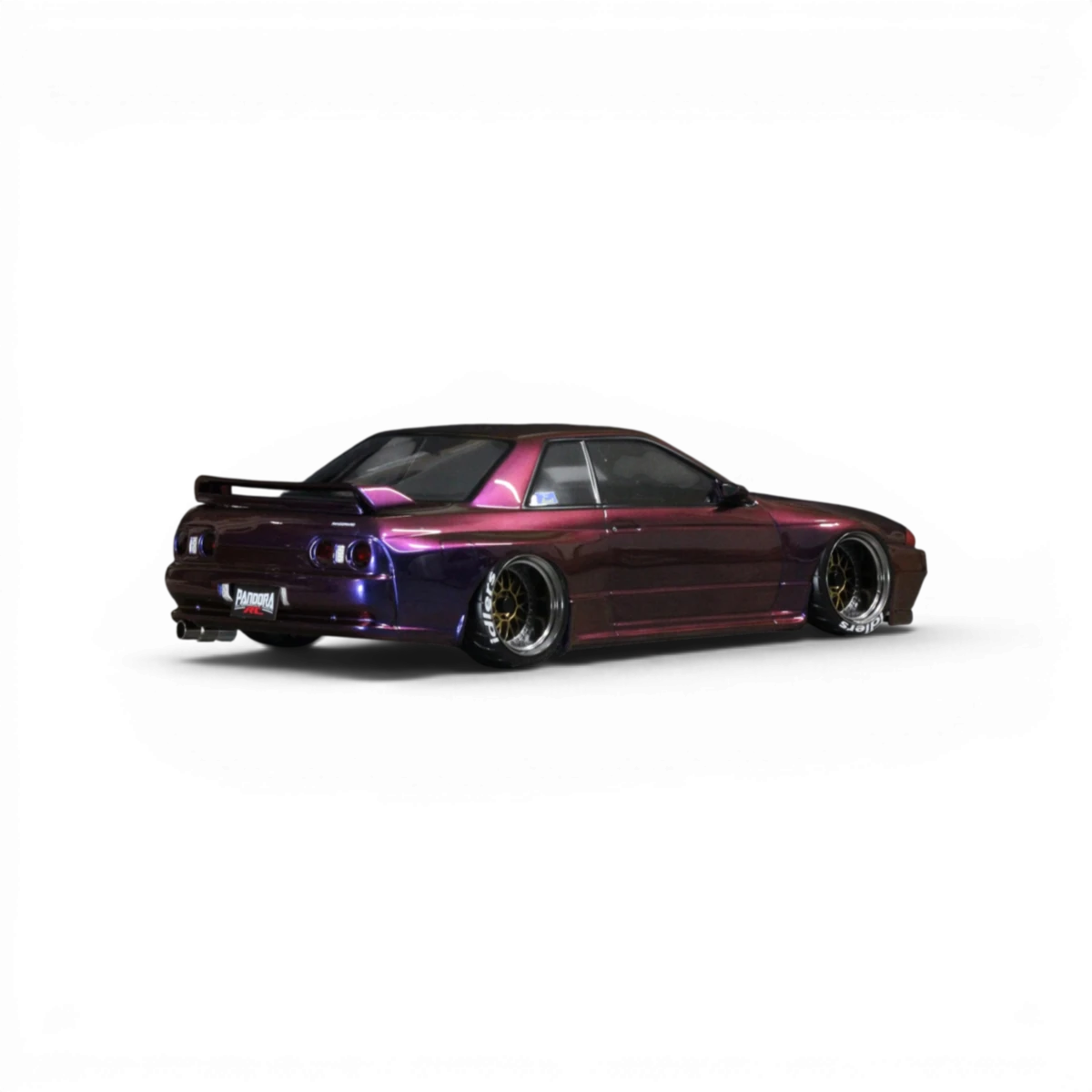 Carrosserie Nissan BNR32 Skyline GT-R Pandora RC pour voiture radiocommandée, vue de face avec détails colorés et logo.