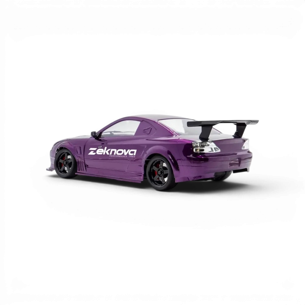 Châssis RC drift HOBBYTECH OVER-D10 RTR Brushless RWD, vue de face avec pneus et composants électroniques visibles.