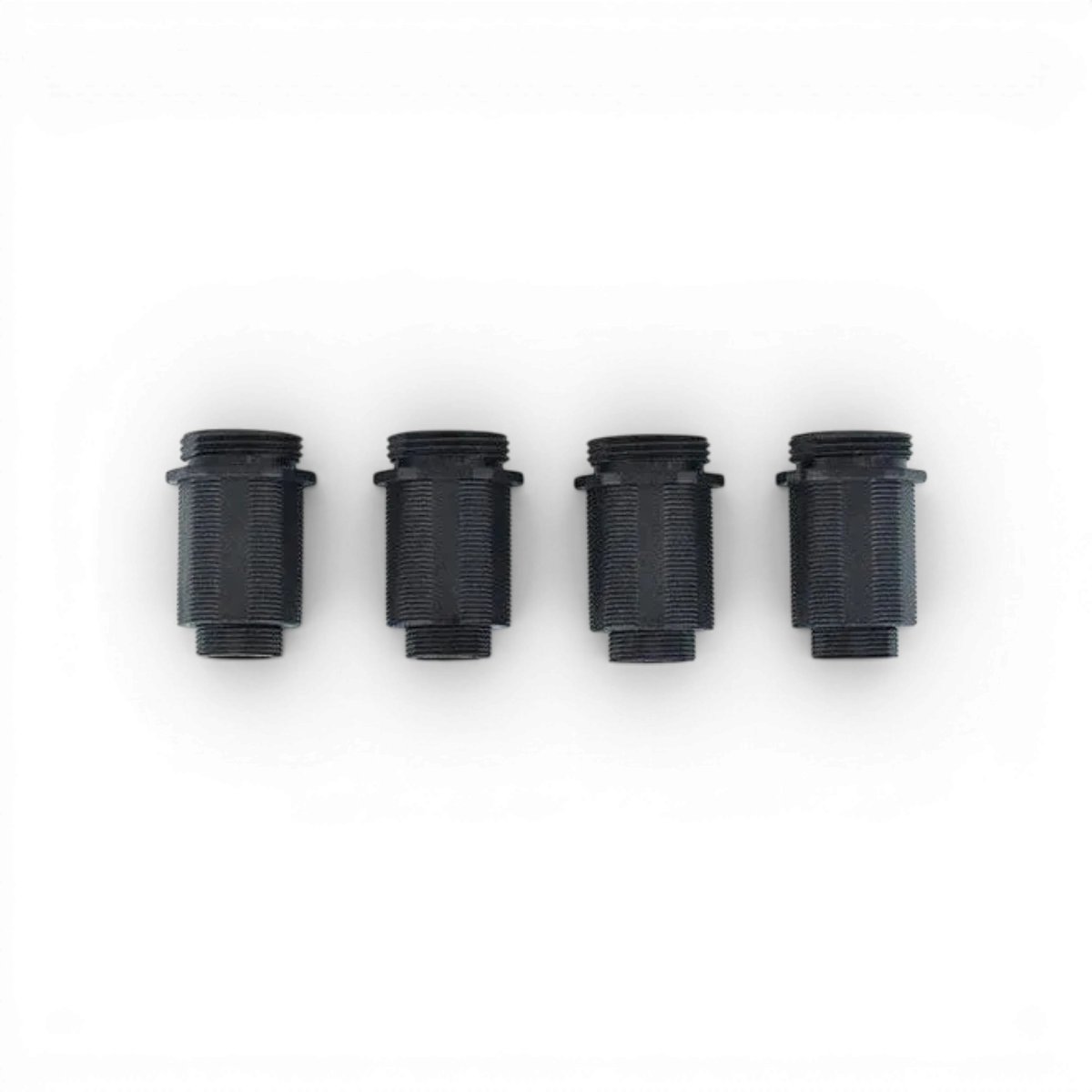Quatre corps amortisseurs RDX de la marque Team Reve D, pour une suspension performante et durable.