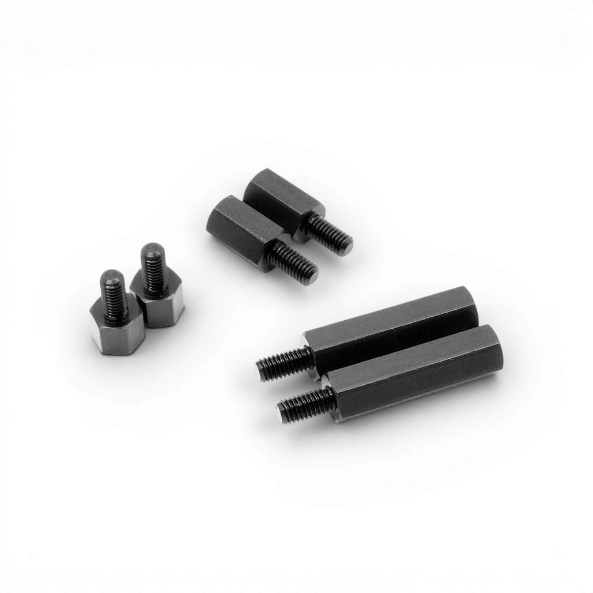 Entretoise d’extension hexagonale en aluminium noire de 6 mm, conçue par Wrap-UP Next, visible en image.