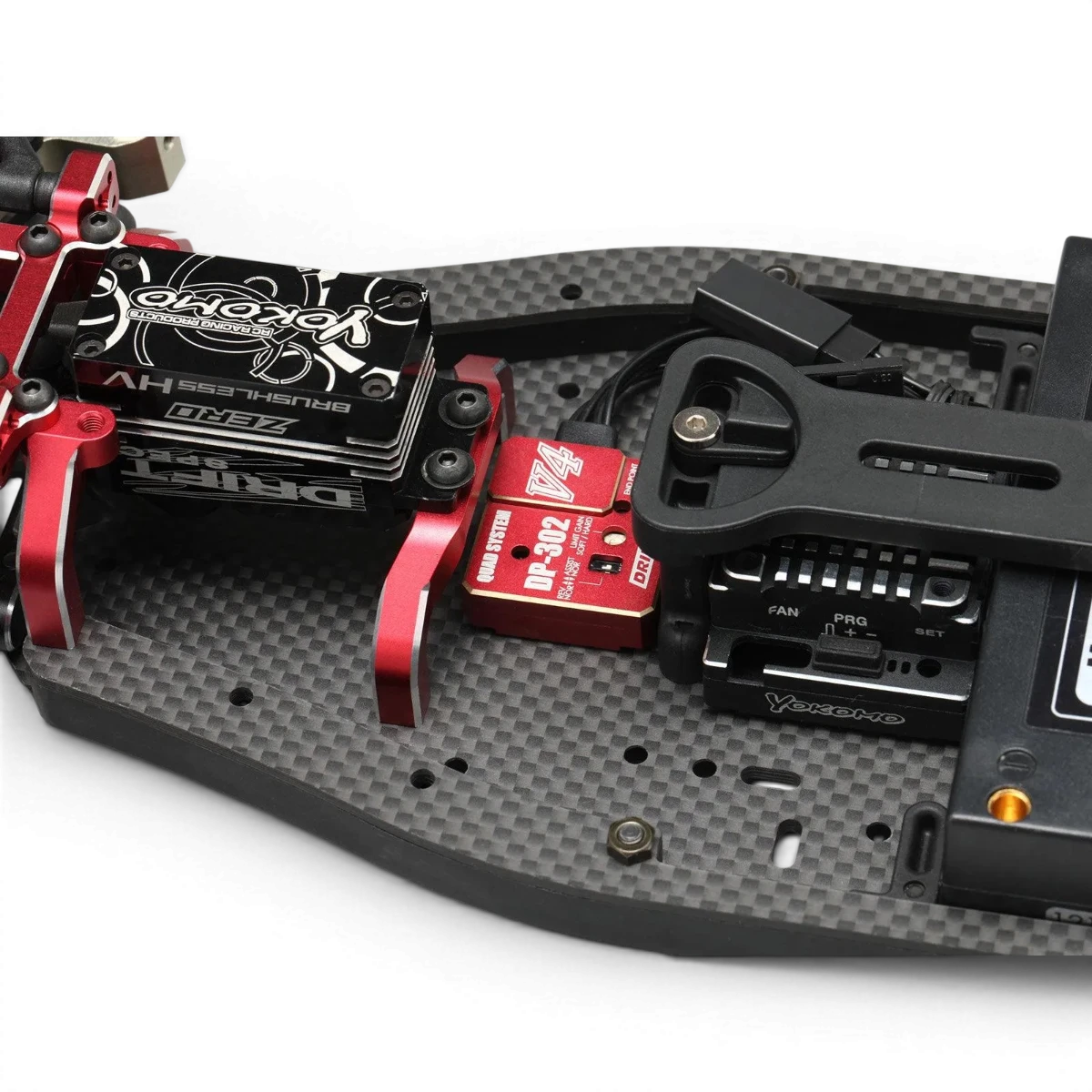 Gyro V4 rouge pour radio contrôlée 2ch/3ch, électronique de marque Team Yokomo, affiché avec écran et boutons.