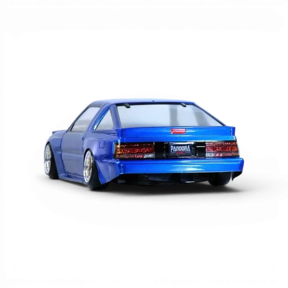 Carrosserie Mitsubishi STARION Pandora RC, détail de la carrosserie de voiture radiocommandée rouge avec logo et finitions précises.