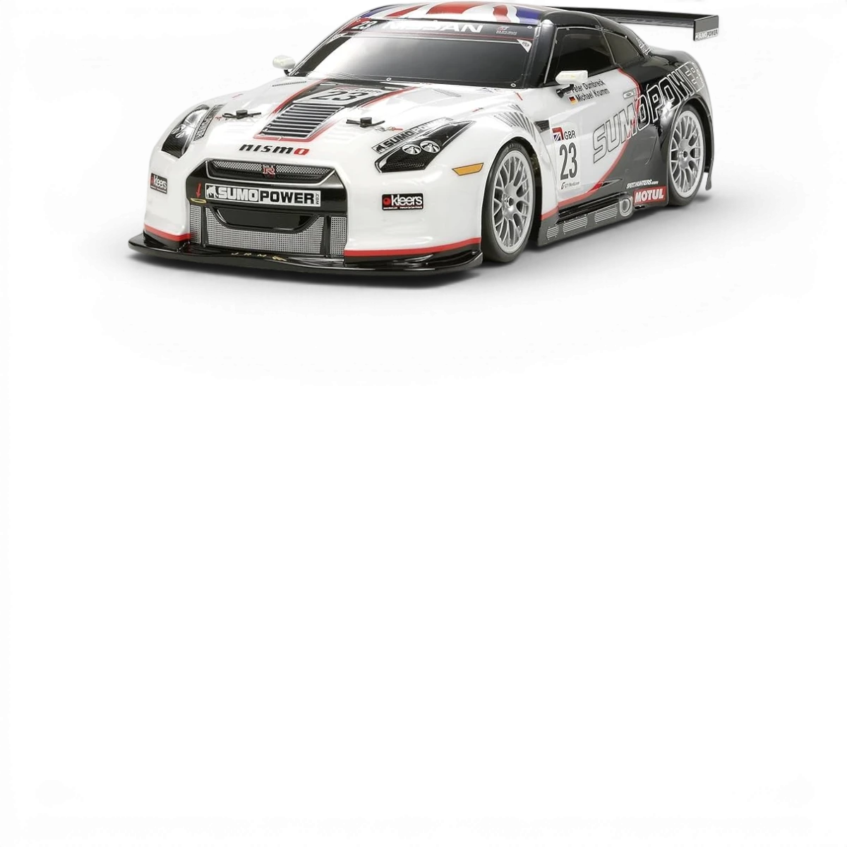 Carrosserie Nissan GTR Sumo Power Tamiya, modèle détaillé pour voiture RC, vue de face avec finition précise et logos visibles.