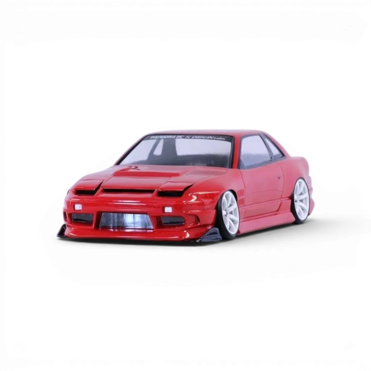 Carrosserie Nissan One-via 240SX Pandora RC, modèle réduit détaillé, en plastique noir avec éléments colorés, vue de face.
