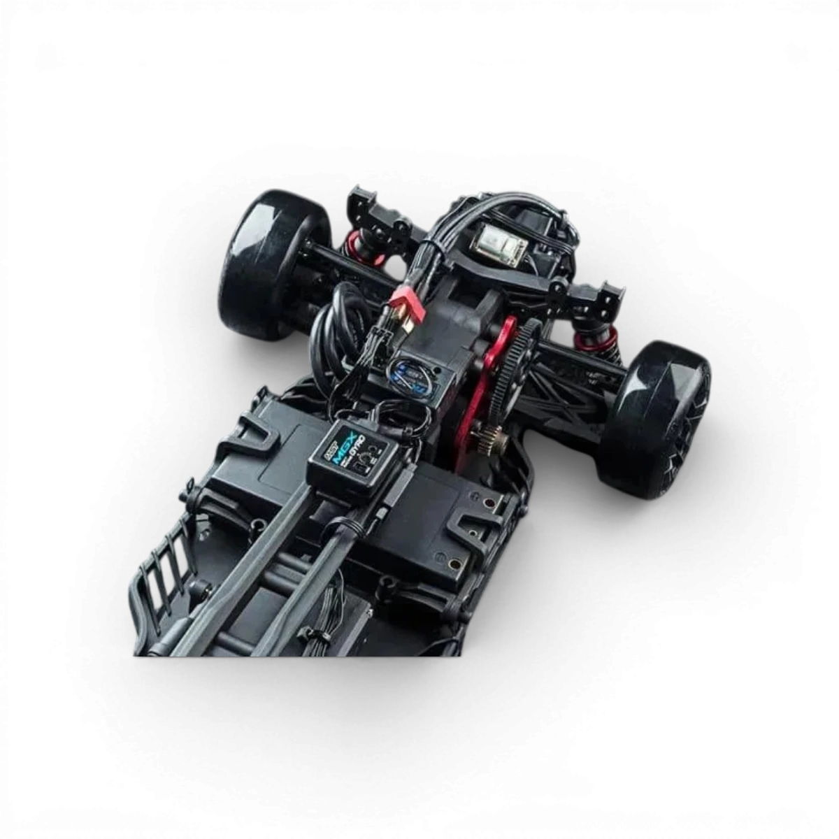 Voiture RC drift brushless Max Speed Technology RB86 Toyota 86RB en bleu, vue de côté sur la piste.