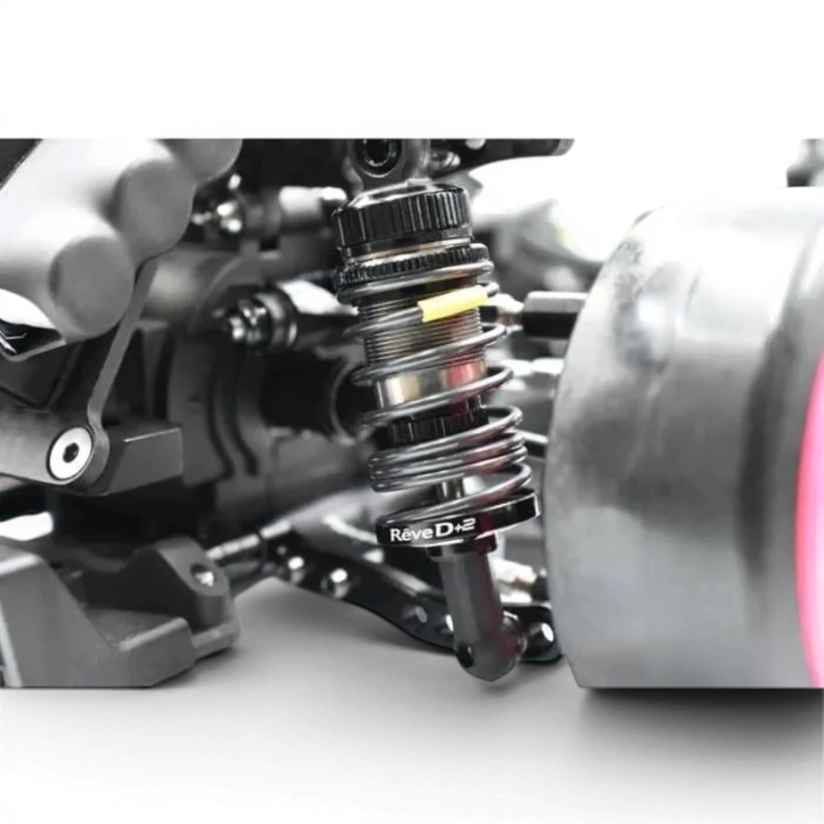 Ressorts arrière R-tune Medium Hard de Team Reve D, pièces détachées pour suspension de véhicule, visibles en image.