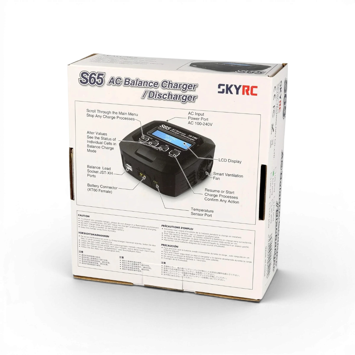 Chargeur AC simple S65 de SkyRc pour appareils électroniques, avec câbles et connecteurs visibles sur l'image.