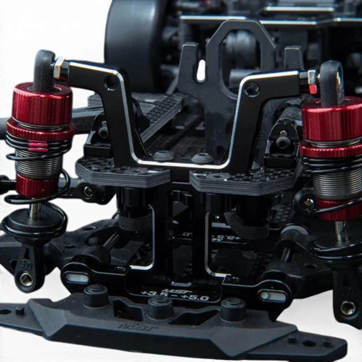 Tour amortisseurs avant en aluminium pour RMX 4 / FRX, pièce détachée Max Speed Technology, visible en détail.