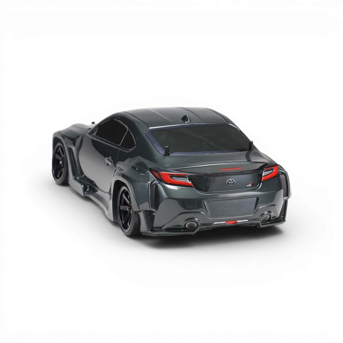 Voiture de carrosserie Toyota GR 86 de Team Yokomo, modèle réduit avec détails réalistes et design sportif.