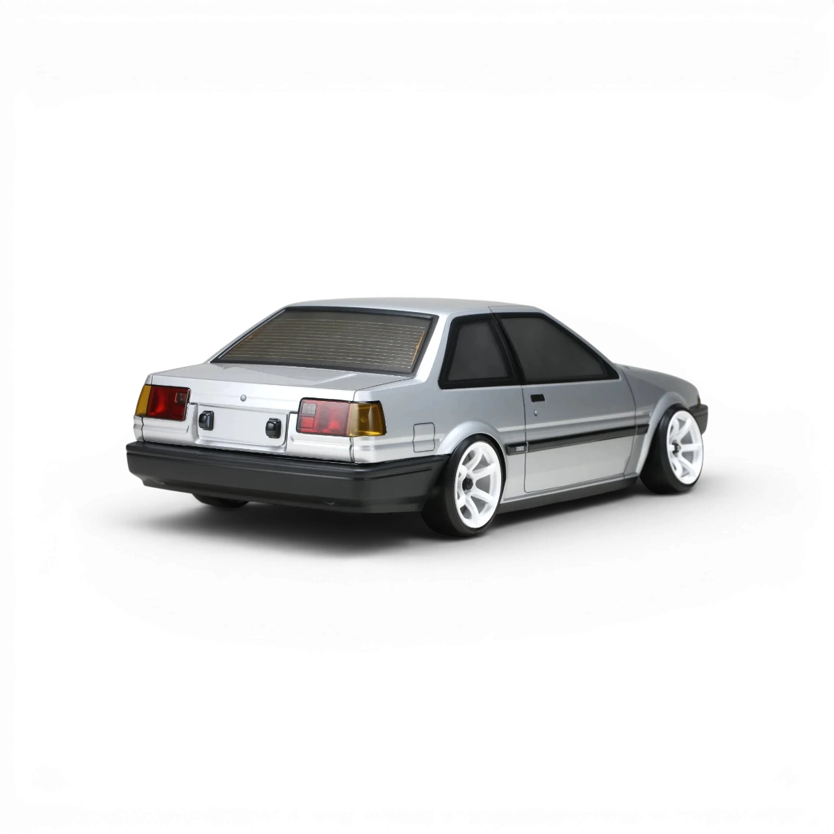 Carrosserie Toyota AE86 Trueno T2 pour voiture RC, modèle de Team Yokomo, en plastique blanc avec détails réalistes.
