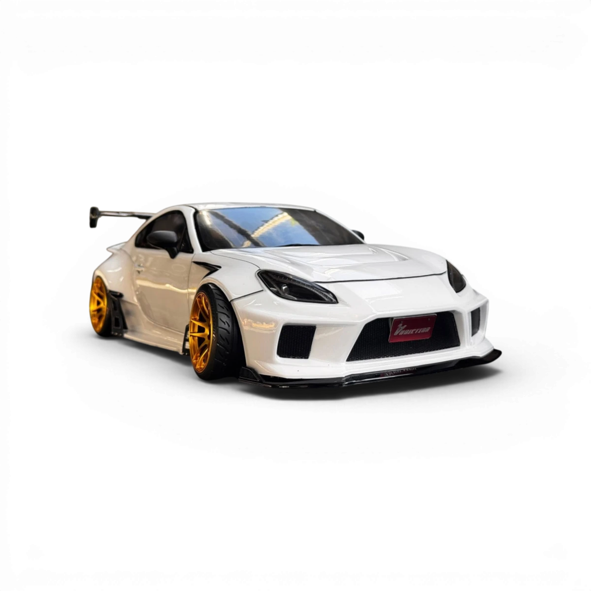 Carrosserie Toyota GR86 Naoki Nakamura Street Ver pour voiture RC, conçue par Addiction RC Design, vue de face avec détails colorés