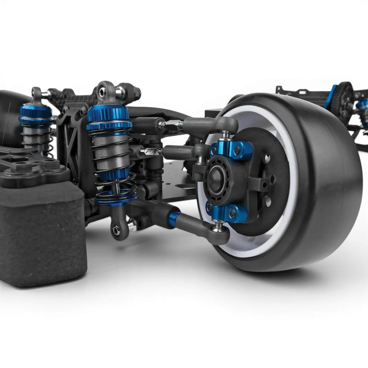 Châssis drift DC10 KIT de DriftParadiZ avec composants en plastique noir et détails pour voiture radiocommandée.