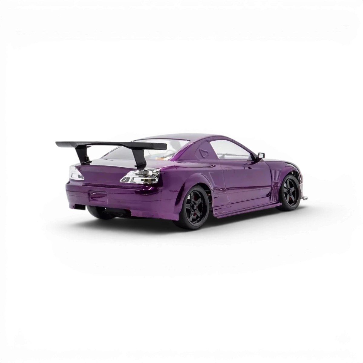Châssis RC drift HOBBYTECH OVER-D10 RTR brushless RWD, vue de face avec composants et pneus de course.
