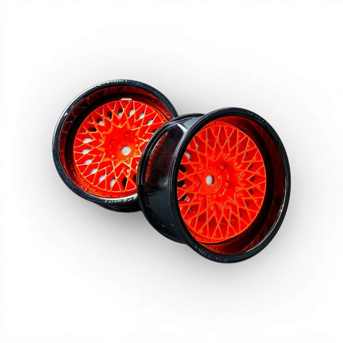 Roues Tetsujin Combo Centre Grand Seeker Orange et Noir, design sportif avec motifs colorés, pour skateboard ou scooter.