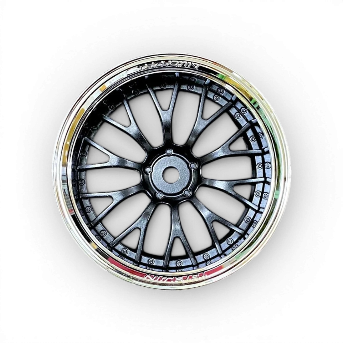 Roues Tetsujin Daisy chrome et noir, design élégant avec finition brillante, adaptées pour véhicules sportifs.