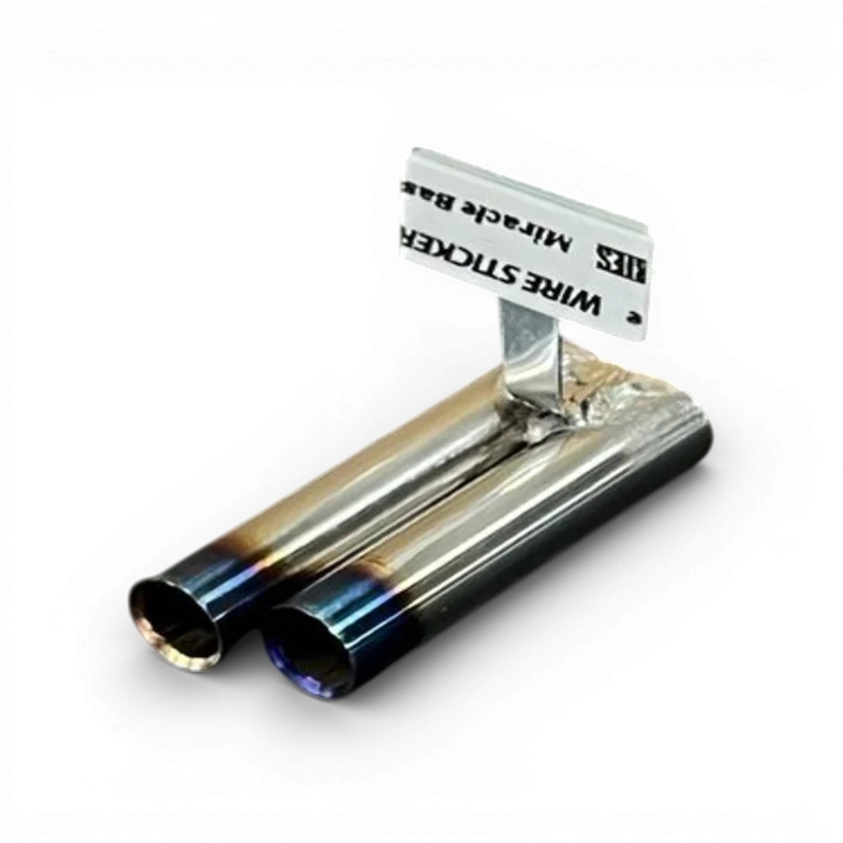 Échappement double 10x30mm "Burn" par ETO Works, pièce de customisation pour moto, visible en image.