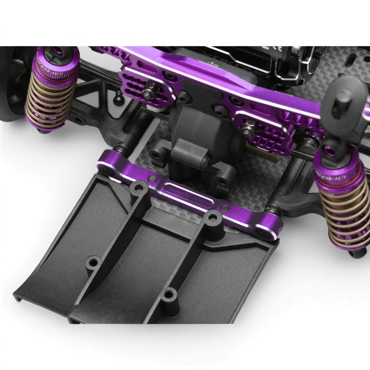 Ensemble de cales triangle YD2 violet édition limitée pour pièces détachées Team Yokomo, montrant les cales en détail.