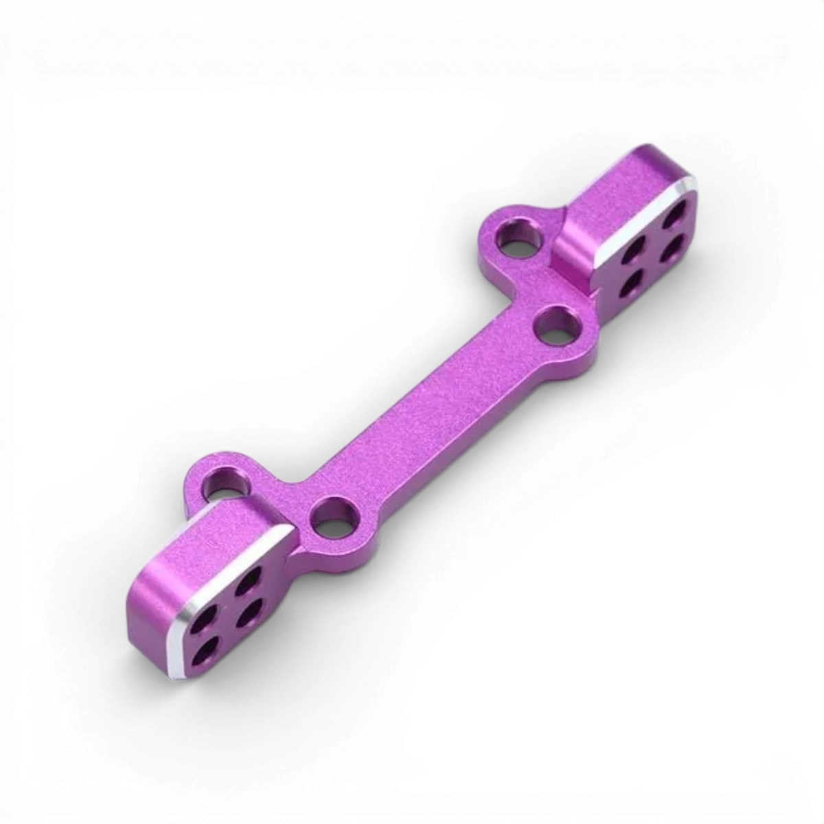 Support triangles supérieurs en aluminium violet pour pièces détachées Team Yokomo, visible avec fixation robuste.