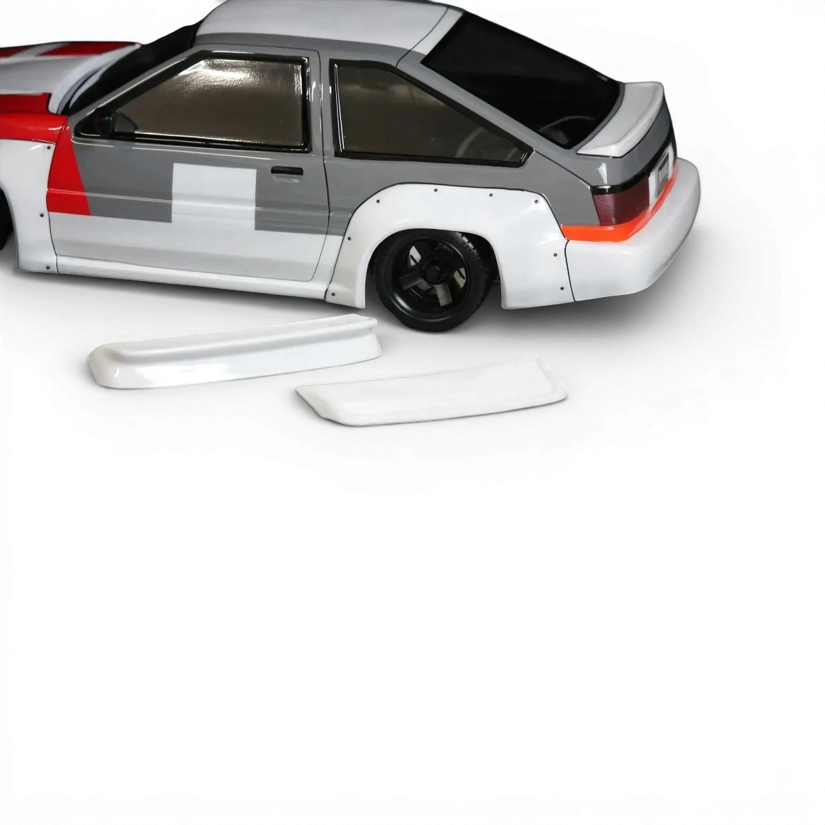 Voiture télécommandée Toyota AE86 Trueno N2 Pandora RC, carrosserie détaillée et réaliste, vue de côté sur fond blanc.