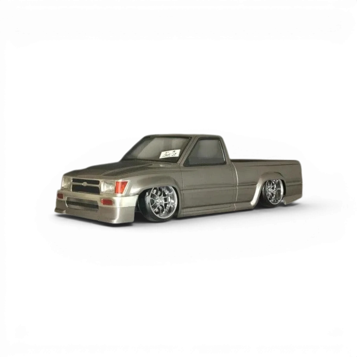 Carrosserie Toyota Hilux RN80 Pandora RC, reproduction réaliste en plastique pour modèle réduit, détails précis et finition soignée.